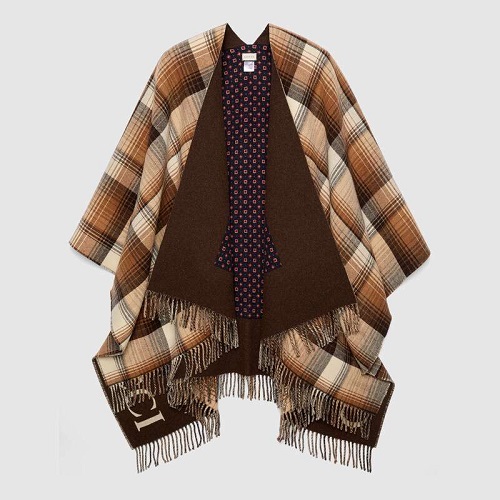 Reversible wool poncho with geometric motif